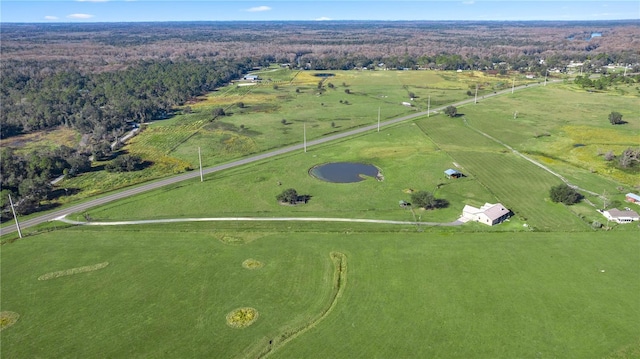 birds eye view of property with a rural view