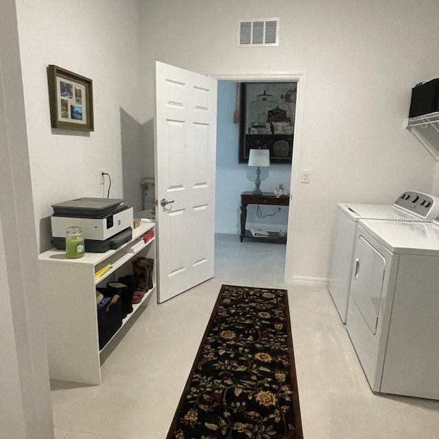 washroom with independent washer and dryer