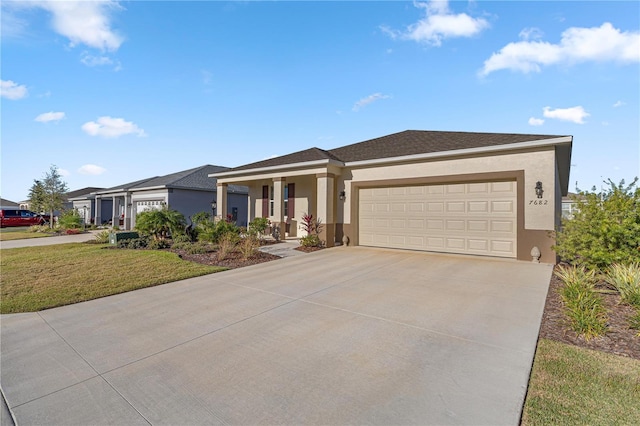 view of front of home with a garage and a front yard