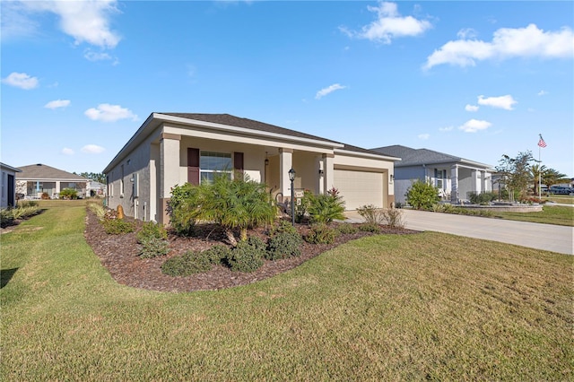 view of front of property with a front yard and a garage