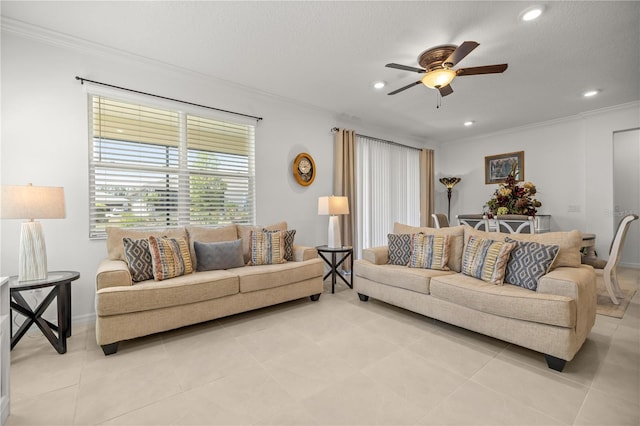 living area with baseboards, ornamental molding, light tile patterned flooring, and ceiling fan