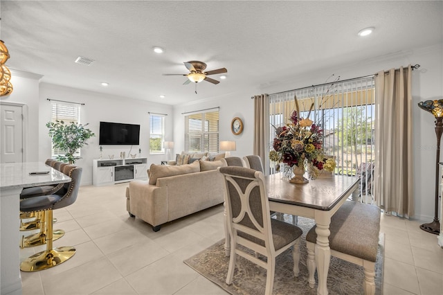 dining area with visible vents, ornamental molding, recessed lighting, a ceiling fan, and light tile patterned floors