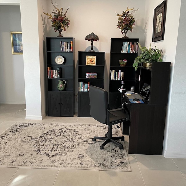 tiled home office featuring baseboards