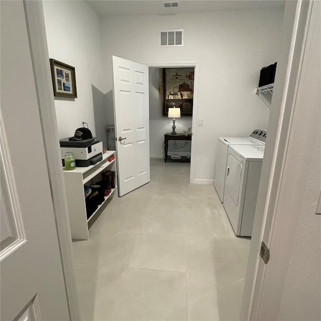 laundry room featuring laundry area, visible vents, and washer and clothes dryer