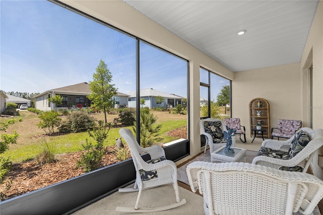 sunroom with an outdoor living space