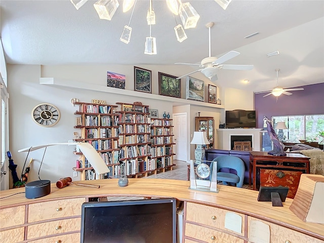 home office with hardwood / wood-style flooring and lofted ceiling