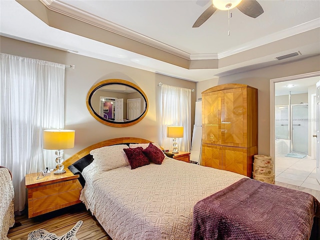 bedroom featuring ensuite bath, ceiling fan, and ornamental molding