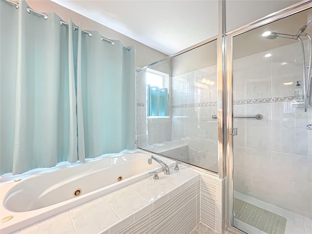 bathroom featuring separate shower and tub