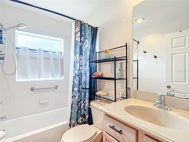 full bathroom with vanity, toilet, and shower / tub combo