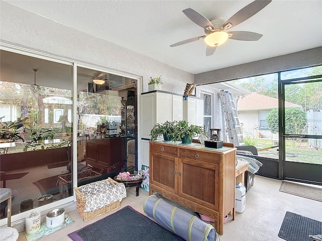 sunroom / solarium with ceiling fan