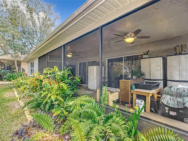 view of patio / terrace featuring ceiling fan