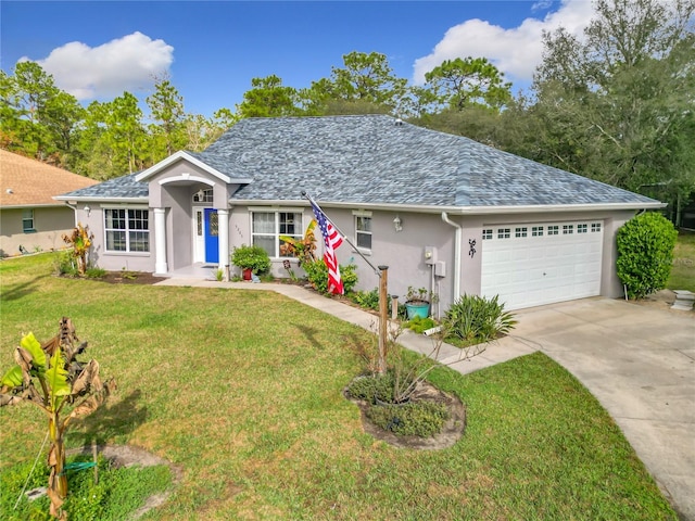 single story home with a garage and a front lawn