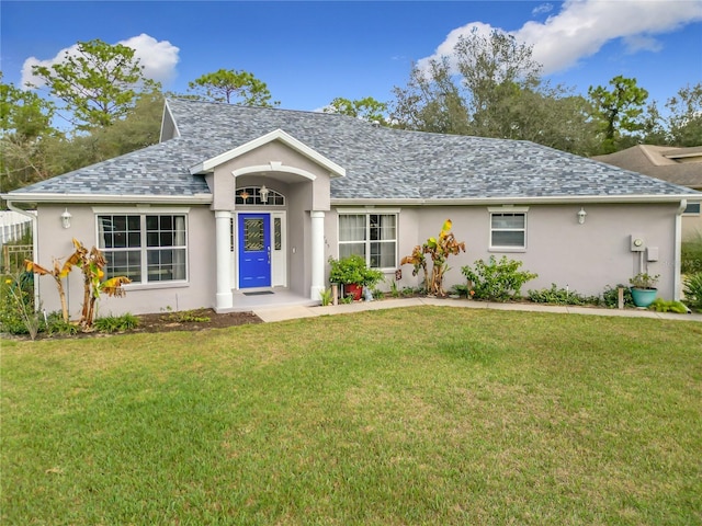 ranch-style house featuring a front lawn