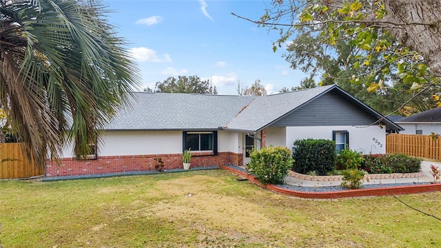 ranch-style home with a front yard