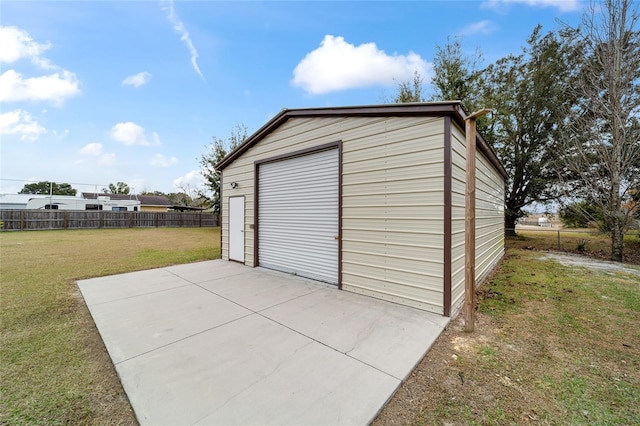 garage featuring a lawn