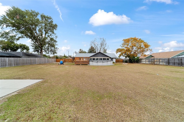 view of yard with a pool side deck