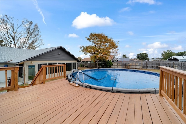 view of swimming pool featuring a deck