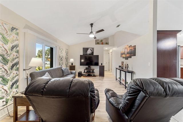 living room with light wood-type flooring, ceiling fan, and lofted ceiling