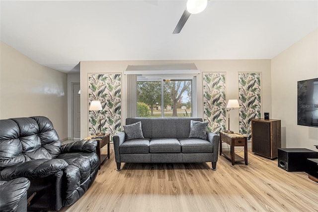 living room featuring ceiling fan and light hardwood / wood-style floors