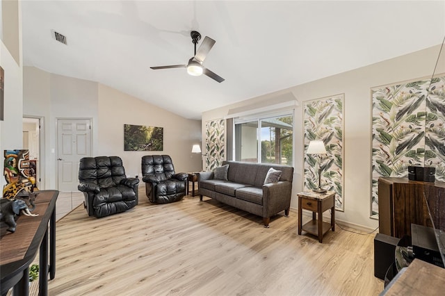 living room featuring ceiling fan, vaulted ceiling, and light hardwood / wood-style floors