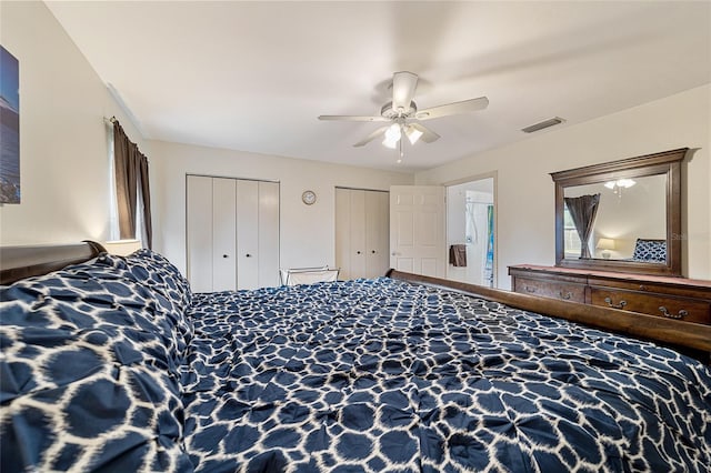 bedroom featuring ceiling fan and multiple closets