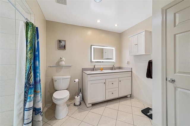 bathroom featuring toilet, walk in shower, tile patterned floors, and vanity