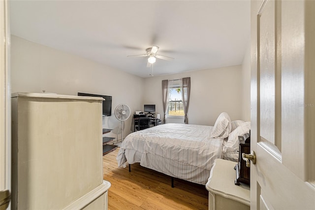 bedroom featuring ceiling fan and wood-type flooring