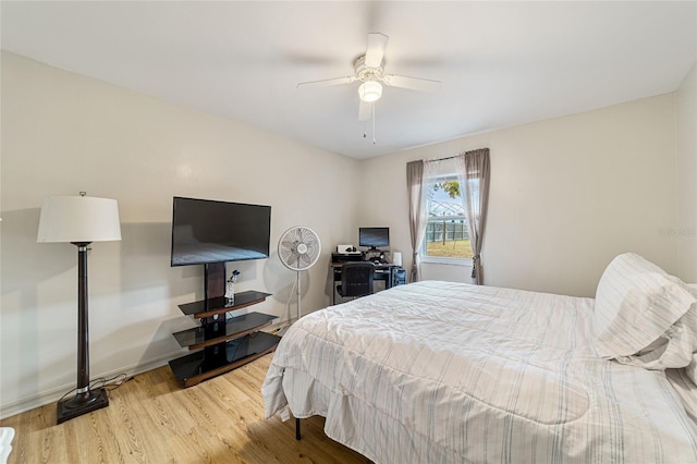 bedroom featuring ceiling fan and light hardwood / wood-style flooring