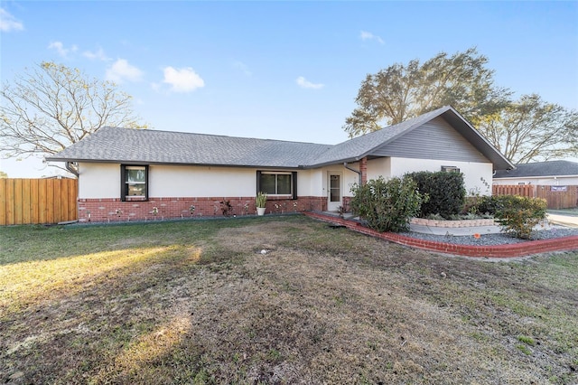 ranch-style house featuring a front lawn