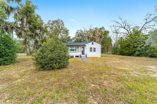 exterior space with a lawn