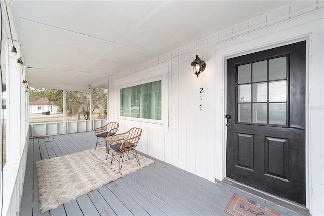 property entrance featuring covered porch