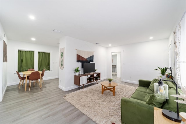 living room with light hardwood / wood-style floors