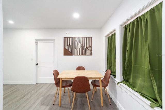 dining area with light wood-type flooring