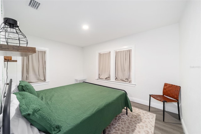 bedroom with wood-type flooring