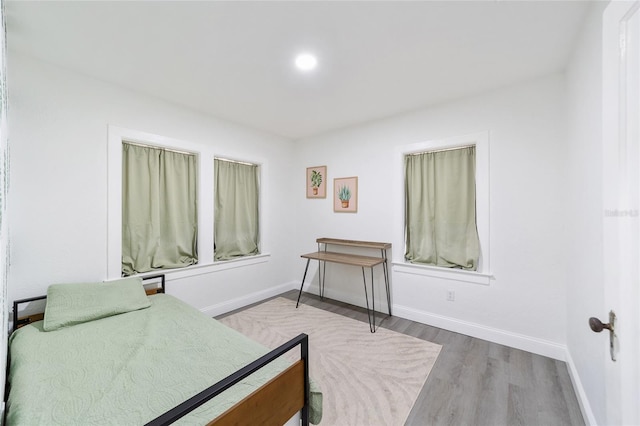 bedroom with hardwood / wood-style floors