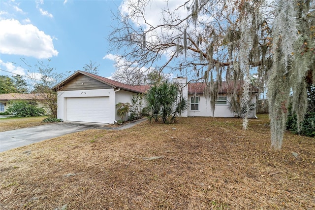 ranch-style home with a front lawn and a garage