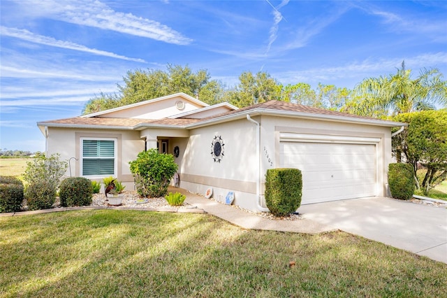 single story home with a garage and a front lawn