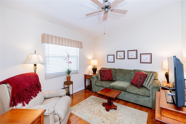 living room with ceiling fan and wood-type flooring