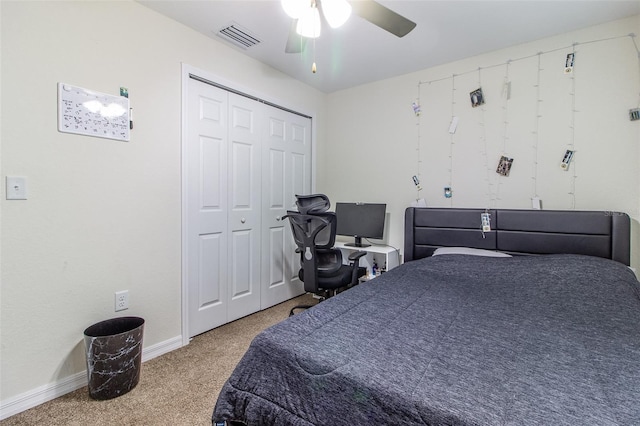 bedroom featuring ceiling fan, a closet, and carpet floors