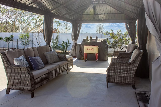 view of patio featuring a gazebo and an outdoor living space