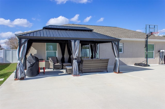 rear view of house featuring a gazebo, an outdoor living space, and a patio