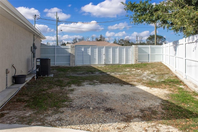 view of yard with central AC