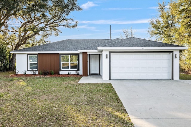 ranch-style house featuring a garage, a front yard, concrete driveway, and a shingled roof