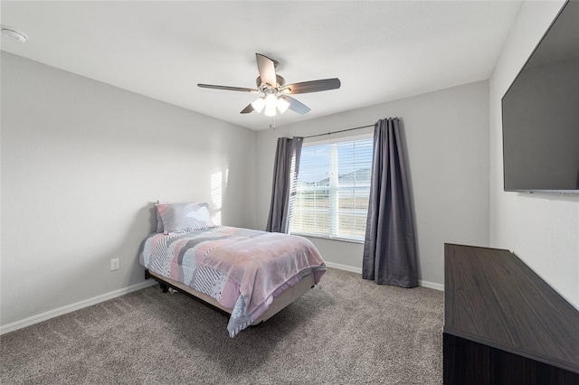 bedroom with ceiling fan and light carpet