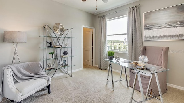 home office with ceiling fan and light carpet