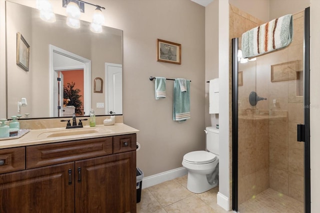 bathroom with tile patterned flooring, vanity, toilet, and walk in shower