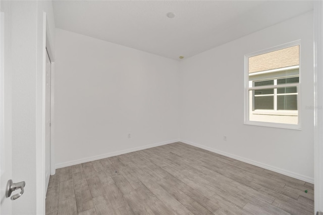 unfurnished room featuring light hardwood / wood-style floors