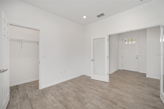 entrance foyer with light hardwood / wood-style flooring