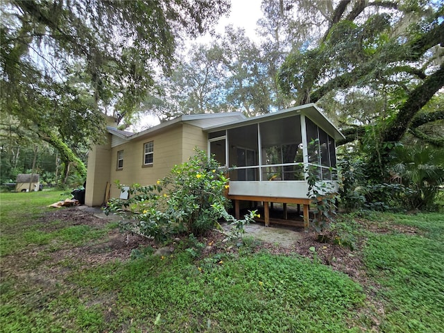 rear view of house with a sunroom