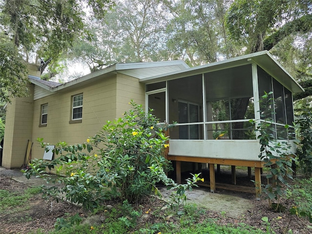 back of house with a sunroom